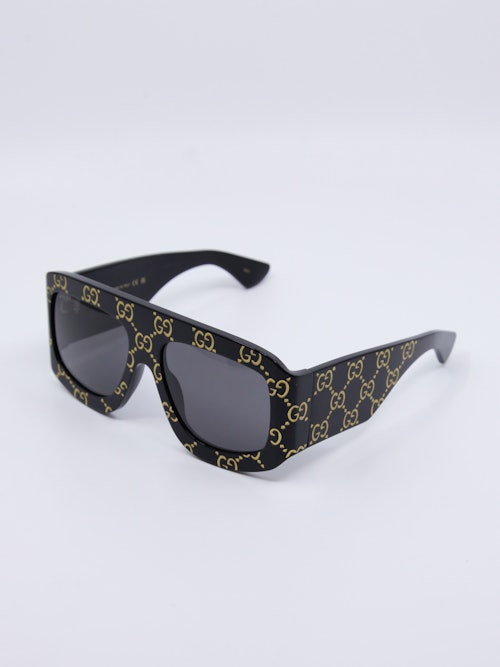 Svart, oversized solbrille dekket med Gucci-logo