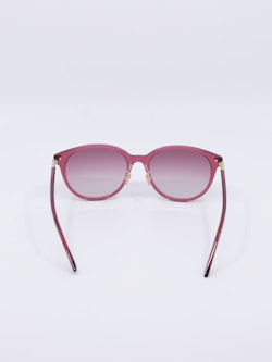 Rund og rosa solbrille med rosa graderte solbrilleglass