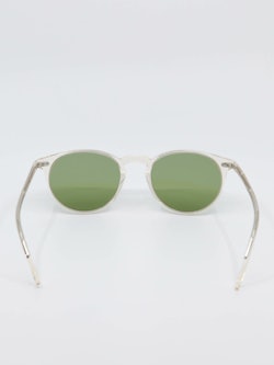 Solbrille med transparent ramme og grønne glass