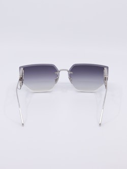 Rammeløs metallsolbrille med graderte solbrilleglass