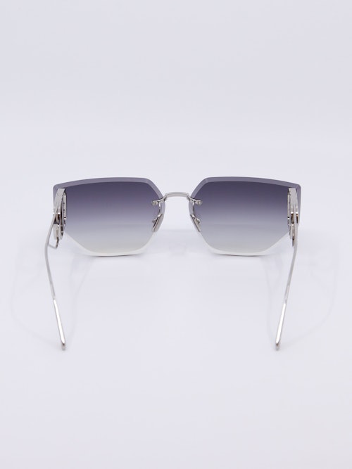 Rammeløs metallsolbrille med graderte solbrilleglass