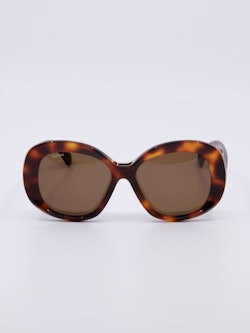 Oversized solbrille i mønstret brun