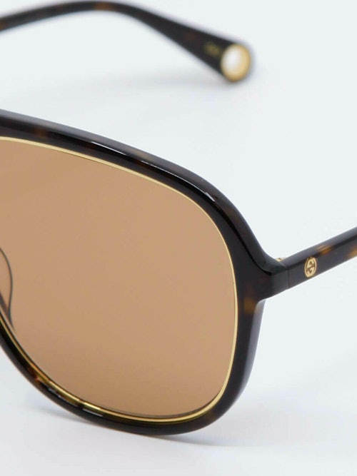 Detaljebilde av solbrille GG1077 fra Gucci
