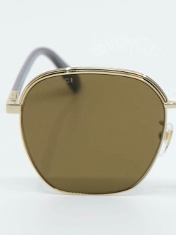 Bilde av metallsolbrille med helfarget brunt glass fra Gucci