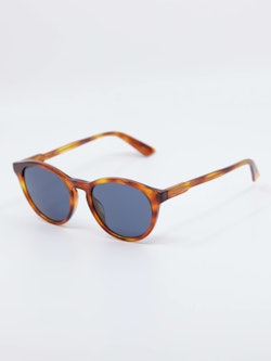 Bilde av rund solbrille med blå brilleglass fra Gucci