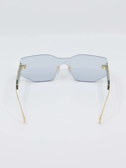 Solbrille uten ramme, gulldetaljer, bilde bakfra