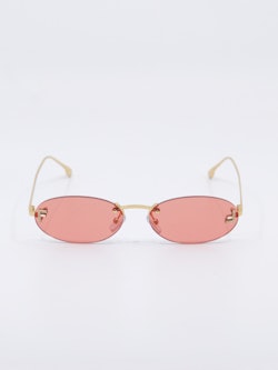 Smale, ovale solbriller i rosa og gull, bilde forfra